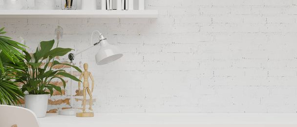 Espacio de trabajo con pared de ladrillo blanco, decoraciones blancas, figura de madera, plantas de interior en mesa blanca con espacio de copia para la exhibición del producto, representación 3d, ilustración 3d - Foto, imagen