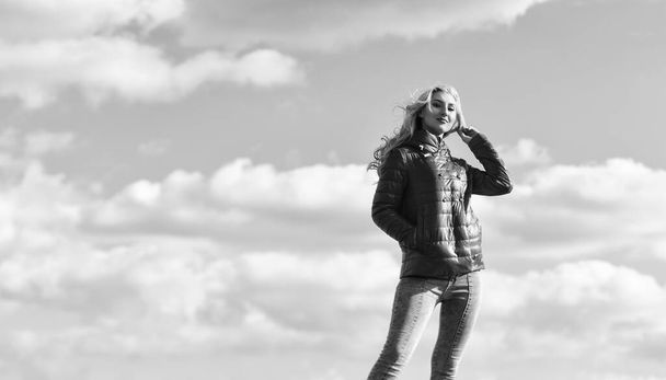 Wind of changes. Female psychology. Woman fashion model outdoors. Woman enjoy cool weather. Matching style and class with luxury and comfort. Fashion outfit. Windy day. Girl red jacket cloudy sky - Foto, Imagem