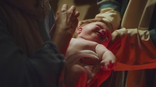 Mary and Joseph comforting crying baby Jesus - Footage, Video