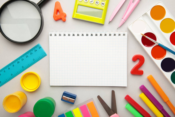 School supplies on grey background with copy space. Top view. - Foto, Imagem