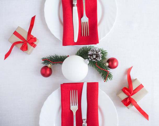 Christmas table setting on the white tablecloth. Top view. Close-up. - Photo, Image