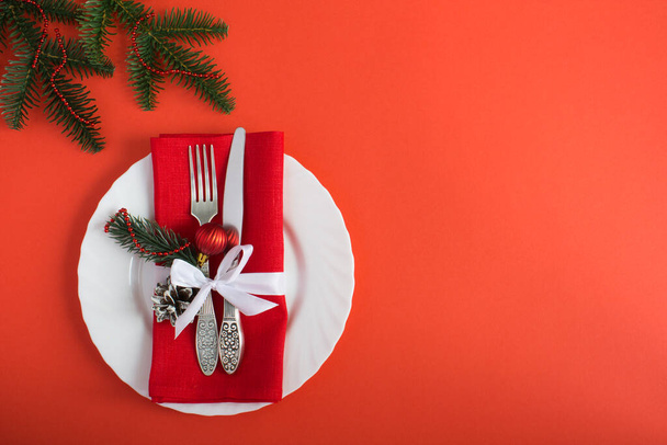 Christmas table setting on the red background. Top view. Copy space. - Photo, Image