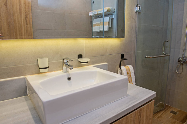 Interior design of a luxury show home bathroom with sink - Fotó, kép