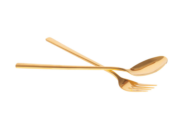 tenedor cuchara latón oro aislado sobre fondo blanco. - Foto, imagen