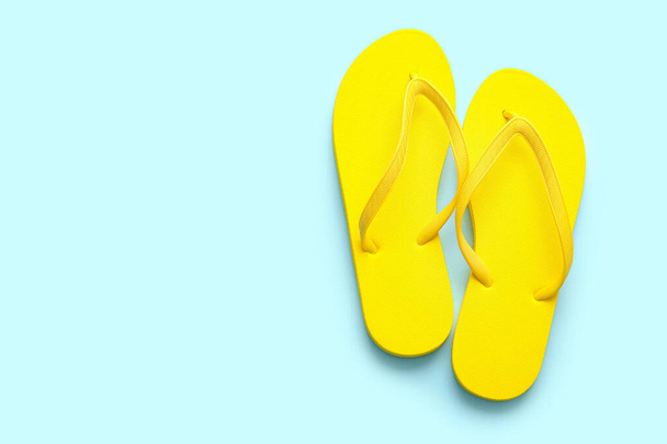 Stylish flip-flops on color background - Photo, Image