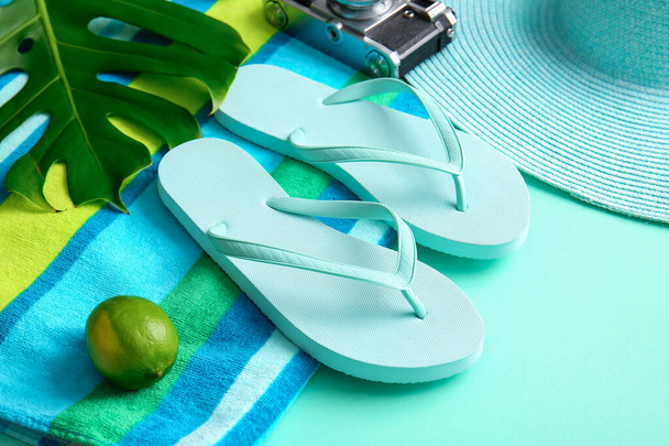 Set of beach accessories with flip-flops on color background - Photo, Image