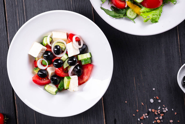 Greek salad feta, olives, vegetables, tomato no meat food organic product meal snack on the table copy space food background rustic. top view keto or paleo diet veggie vegan or vegetarian food  - Photo, Image