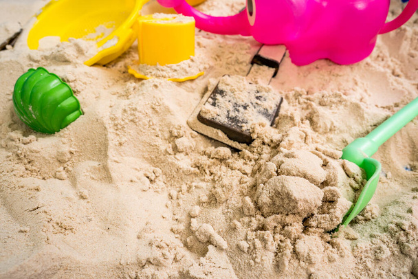 A colorful toys on the beach sand - Fotó, kép