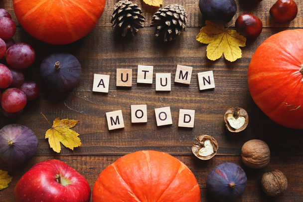 Autumn postcard with seasonal products and inscription Autumn mood made from wooden letters. Top view, flat lay - Fotoğraf, Görsel
