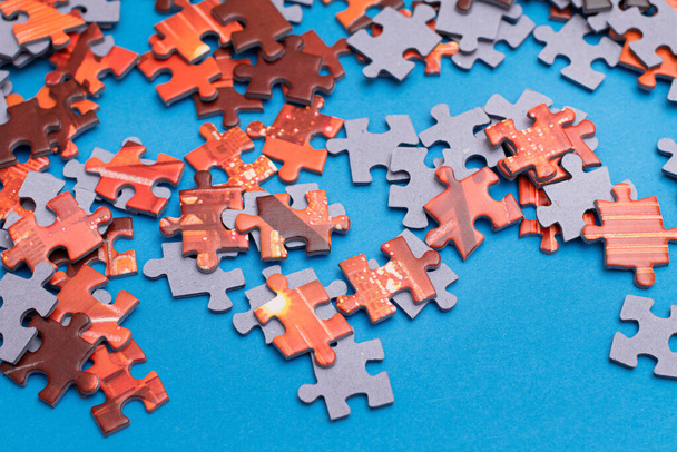Colorful Jigsaw Puzzle on Blue Background - Foto, afbeelding