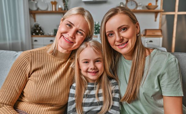 Family portrait of mother, daughter and grandmother. Generations of women. Concept of women's day, mother's day, motherhood, family, love. - Fotoğraf, Görsel