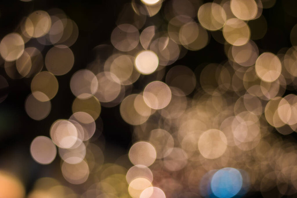 Gold color bokeh elegant abstract background with bokeh defocused lights - Photo, Image
