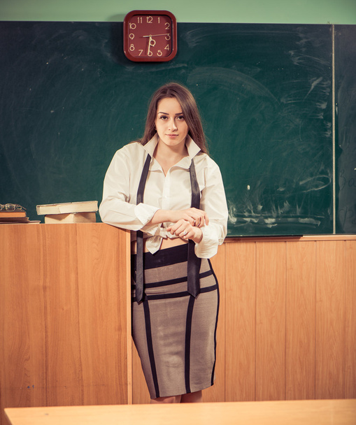 Young teacher at classroom - Foto, afbeelding