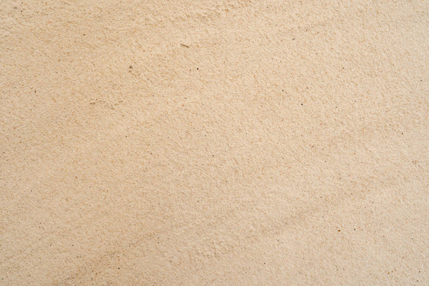A closeup shot of a textured light brown surface background - Foto, afbeelding