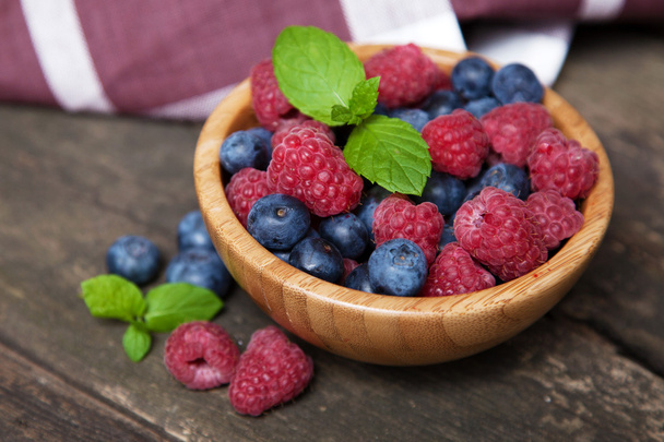 Fresh berries on a wooden table - Valokuva, kuva