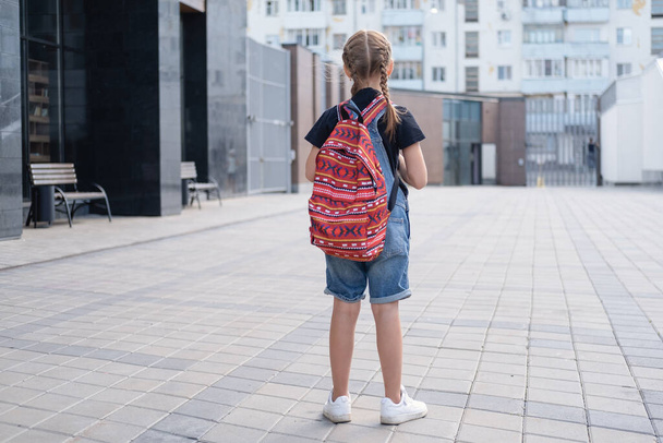 Rare view of girl with backpack go to school - 写真・画像