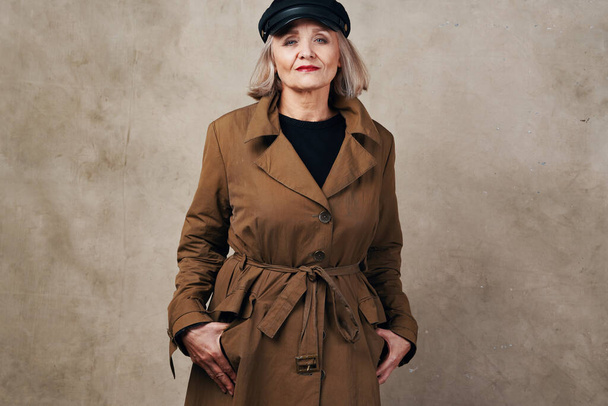 pretty elderly woman in coat black hat fashion - Fotografie, Obrázek
