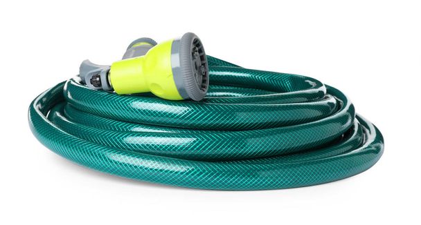 Green rubber watering hose with nozzle isolated on white - Foto, immagini