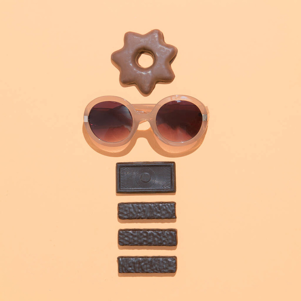 Chocolate candy cookies mix and sunglasses fashion. Diet, addict, calorie, sweet lover, present concept. Choco mood Flat lay minimal art - Foto, imagen