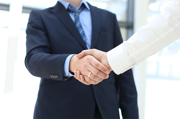 Closeup of a business hand shake between two colleagues - Photo, Image