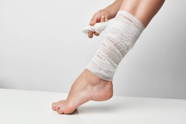health problems, bandaged leg  close-up. High quality photo - Foto, afbeelding