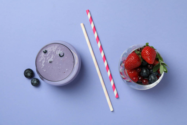 Blueberry smoothie, ingredients and straws on violet background - Fotografie, Obrázek
