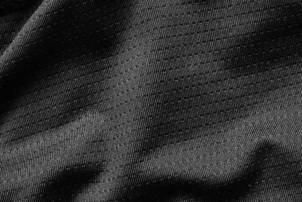 Camisa de fútbol de tela deportiva negra textura de jersey de cerca - Foto, Imagen