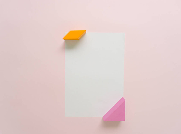Creative arrangement of colorful, trendy, modern geometrical shape objects and white paper. Flat lay. - Photo, image