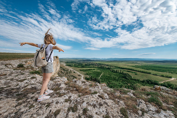 Girl hiking tourist on mountain with backpack. - Φωτογραφία, εικόνα