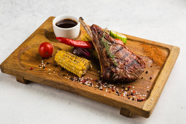 restaurant dish with grilled meat and vegetable side dish - Foto, imagen