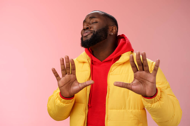 Relax I deal it. Unbothered chill good-looking confident bossy african bearded guy smiling asking enough stop apologizing raise palms calm down gesture grinning blushing heartwarming greeting - Photo, Image