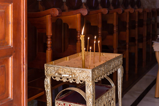 A place for lighting candles in the small monastery of St. George on the border of the Jewish and Armenian quarters in the old city of Jerusalem, Israel - Photo, Image