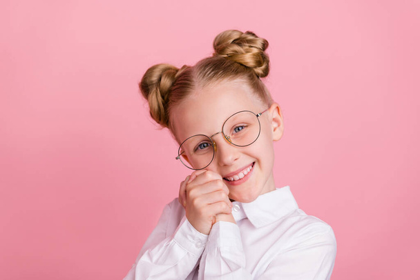 Photo of little friendly girl hands face wear white shirt spectacles isolated on pastel pink color background - Foto, Bild