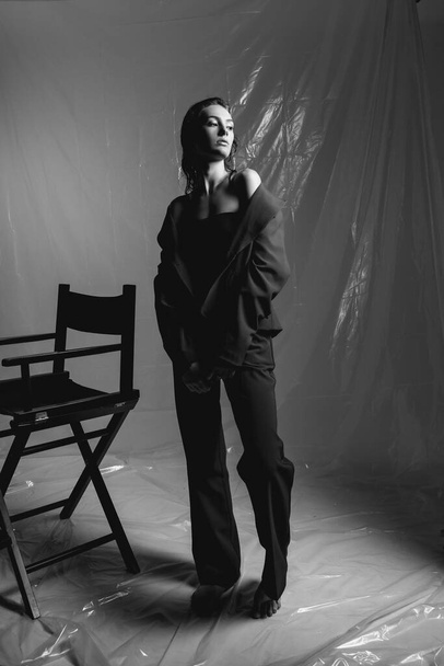 portrait of fashionable  young  woman   posing in studio, black and white  - Valokuva, kuva