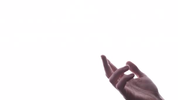 Человек делает жест рукой с ярко-белым фоном - Кадры, видео