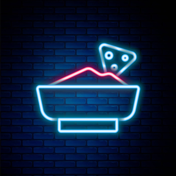 Ragyogó neon vonal Nachos tálban ikon elszigetelt téglafal háttér. Tortilla chips vagy nachos tortillák. Hagyományos mexikói gyorsétlap. Színes vázlat koncepció. Vektor - Vektor, kép