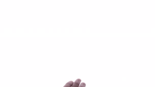 Person macht Handbewegung vor strahlend weißem Hintergrund - Filmmaterial, Video