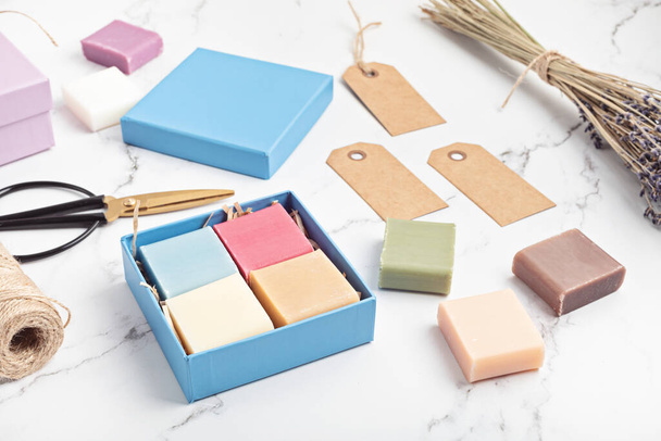 Packaging gift box with handmade natural bar soaps. Ethical, sustainable zero waste lifestyle. DIY, hobby, artisan small business idea. Top view, mockup - Fotoğraf, Görsel