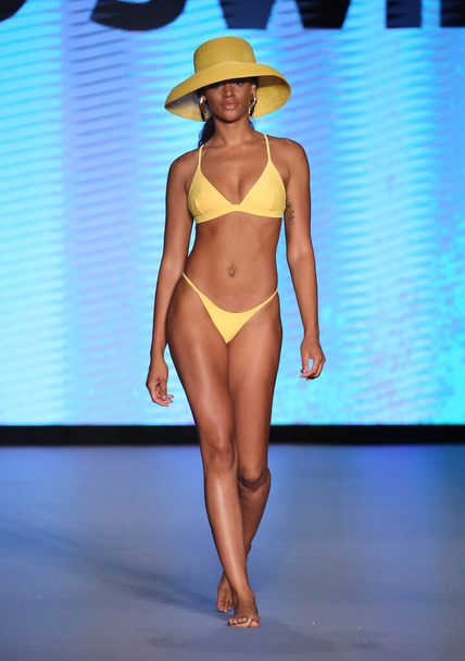 MIAMI BEACH, FLORIDA - JULY 10:  A model walks the runway during Life by Style Group Collective: Avid Swim Show for Miami Swim Fashion Week at Paraiso Miami Beach at The Paraiso Tent on July 10, 2021 in Miami Beach, Florida. - Foto, Bild