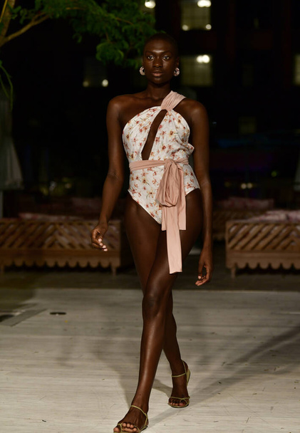 MIAMI BEACH, FLORIDA - JULY 07: A model walks for the Sinesia Karol Miami Swim Week Paraiso Miami Beach Presentation at The Goodtime Hotel on July 07, 2021 in Miami Beach, Florida. - Фото, изображение