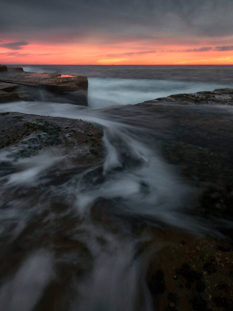 beautiful sunrise on the coast from the rocks - Photo, Image