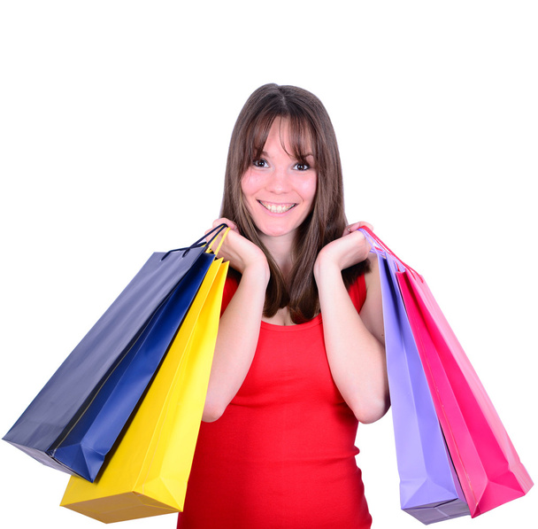 Nuori kaunis ostoksia nainen myynnissä tilalla monia värikkäitä sho
 - Valokuva, kuva