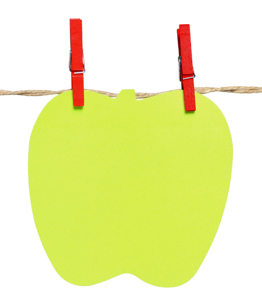 Bloco de notas em forma de maçã pendurada em uma corda
 - Foto, Imagem