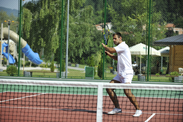 Young man play tennis outdoor - Zdjęcie, obraz