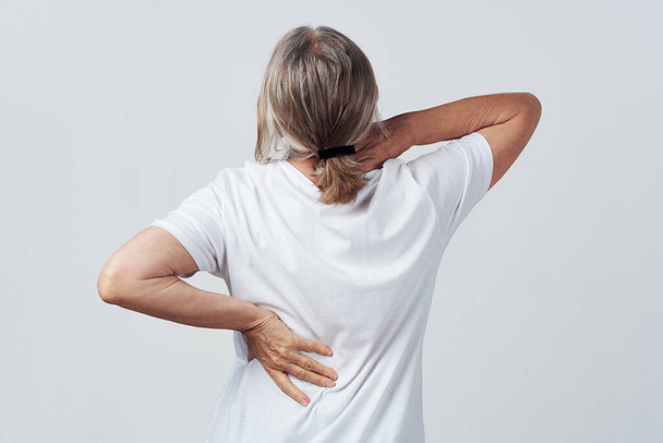 elderly woman back pain back view health problems - Photo, Image