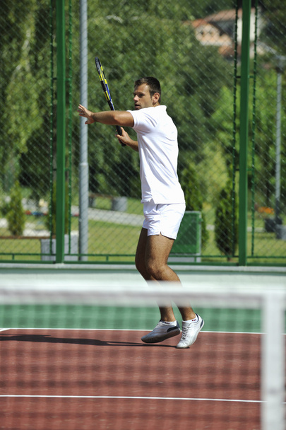Young man play tennis outdoor - Foto, Imagem