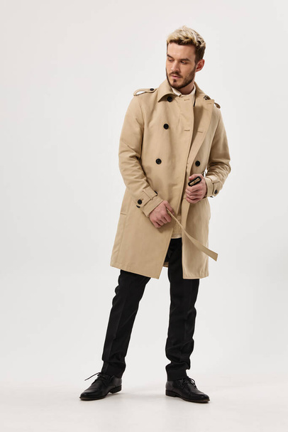 man in coat fashion modern style studio isolated background - Photo, image
