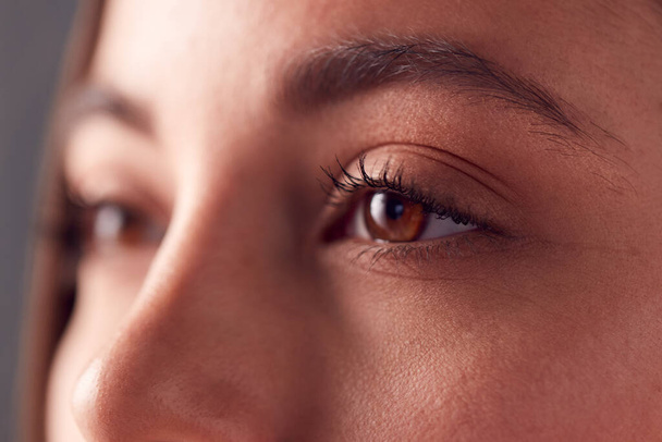 Close Up On Eyes Of Smiling Young Woman Shot Full Frame In Studio - Foto, Imagem