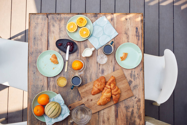 Overhead Shot Of Table Set For Breakfast Outdoors On Deck At Home - Fotografie, Obrázek
