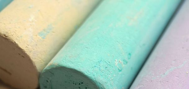 Close-up texture of chalk for drawing multicolored green, blue, yellow, purpleClose-up texture of chalk for drawing multicolored green, blue, yellow, purpleClose-up texture of chalk for drawing - Photo, image